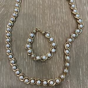 Faux pearl and gold bracelet and necklace